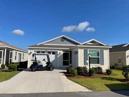 Stylish home with gourmet kitchen, dual garages, and private golf cart!