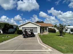 Sunlit retreat overlooking championship fairways—your Florida oasis awaits!