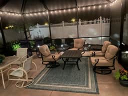Sunlit open-concept retreat w/granite kitchen island, golf cart & dual lanai.