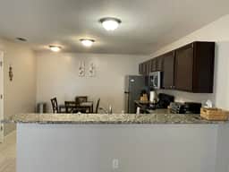 Stylish Home in Duval w/Granite, Tile Floors, Glass Lanai & Gas Golf Cart!