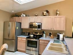 This home has it all! Golf Cart, BBQ Grill & Close to Recreation!!