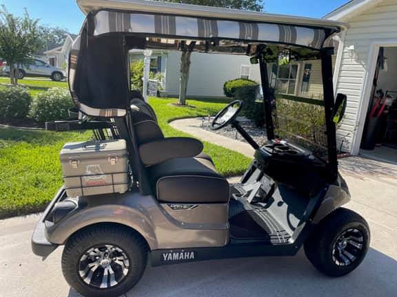 Cozy home w/golf cart, lanai, smart TVs, & prime location near town squares!