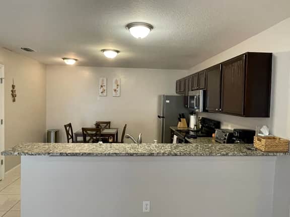 Stylish Home in Duval w/Granite, Tile Floors, Glass Lanai & Gas Golf Cart!