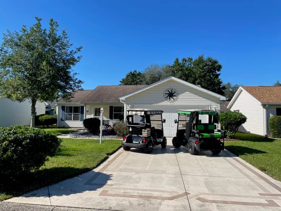 Cozy home w/golf cart, lanai, smart TVs, & prime location near town squares!